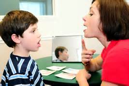 teacher working with a student 